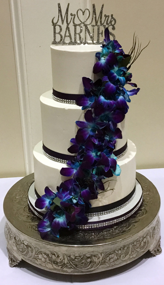 3 Tier buttercream wedding cake, decorated with plum and diamond bling ribbons and fresh cascading orchids delivered at The Gettysburg Hotel PA