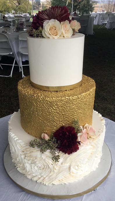 3 Tier buttercream wedding cake, decorated with edible gold sequins and buttercream rosette ruffles