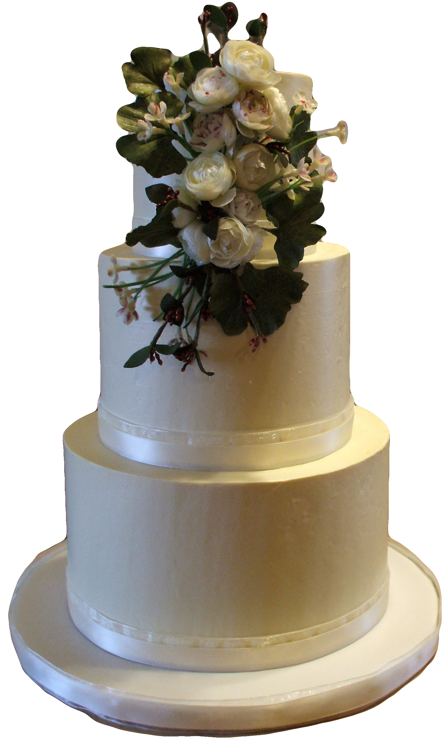 3 tier buttercream wedding cake  decorated with silk flowers